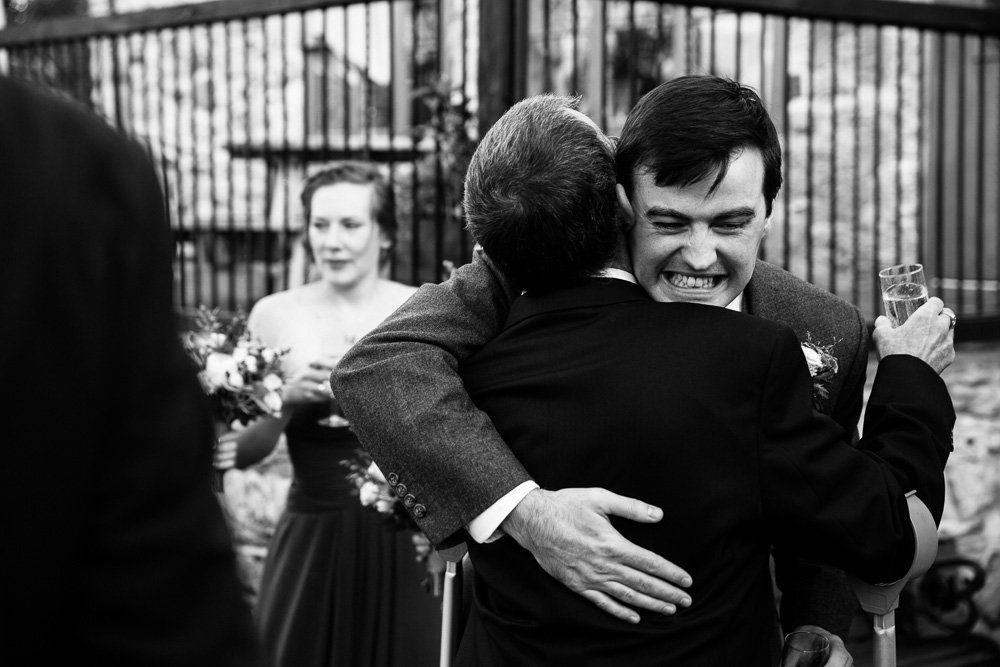 Groom wedding hug